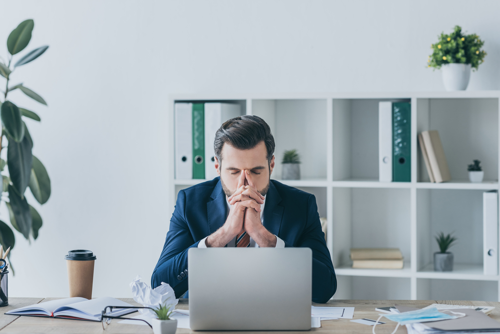 A stressed lawyer working late in the office, symbolizing the need for specialized addiction treatment